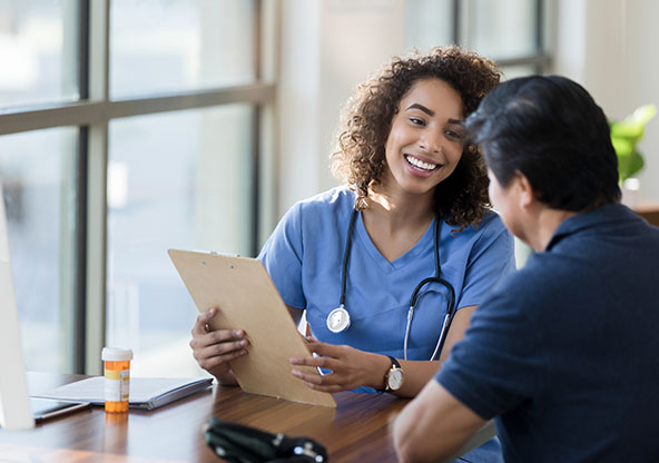 Doctor talking to a patient about immunotherapy