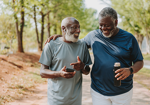 Two older men are on a walk