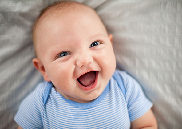 A happy, laughing baby boy