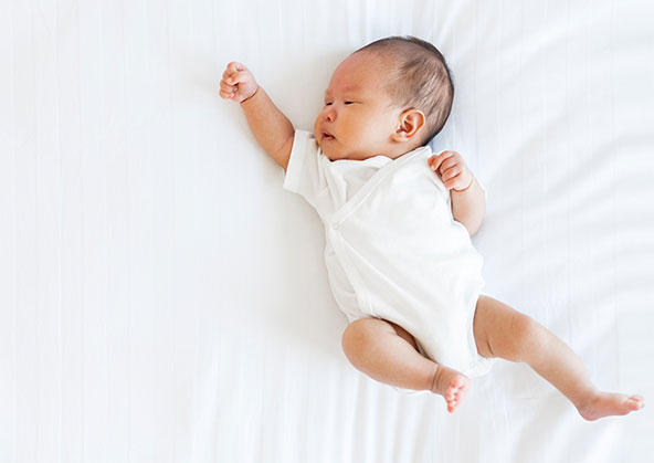 A sleeping newborn baby