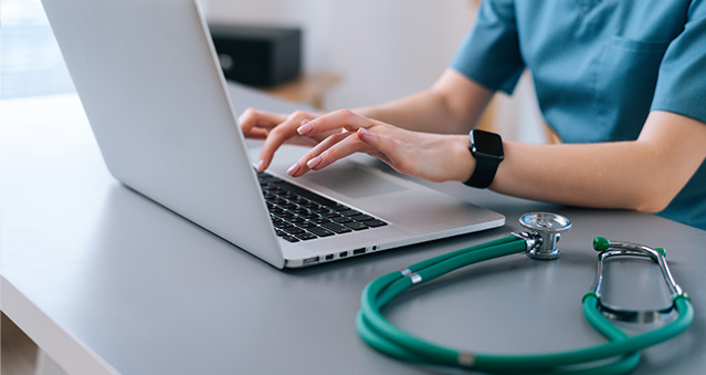 A doctor completes their billing online