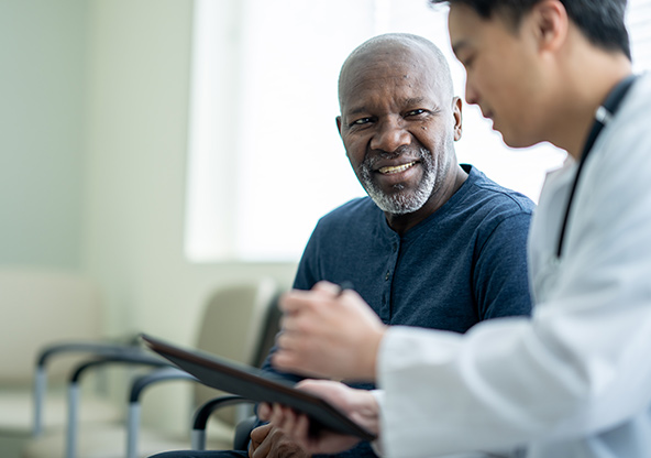 A man discusses his test results with his doctor